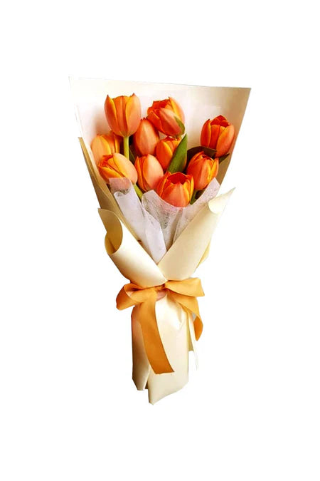 “Graduation bouquet with bright orange tulips wrapped for celebration by GreenDecor Riyadh”