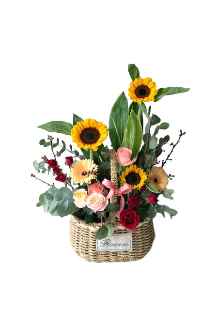 “Joyful New Year mixed flower bloom basket with roses and festive wrapping by GreenDecor Riyadh”